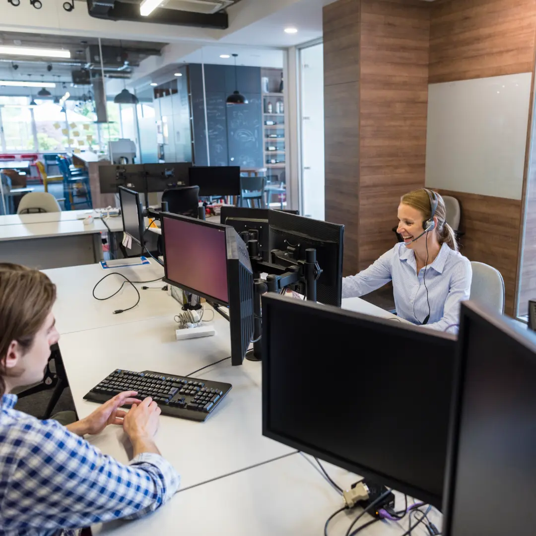 Colleagues working at desks in modern office