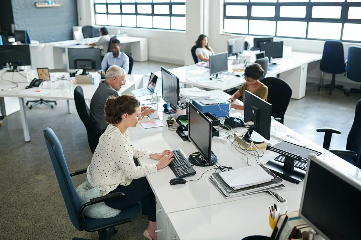 shot-of-a-group-of-coworkers-sitting-at-their-work