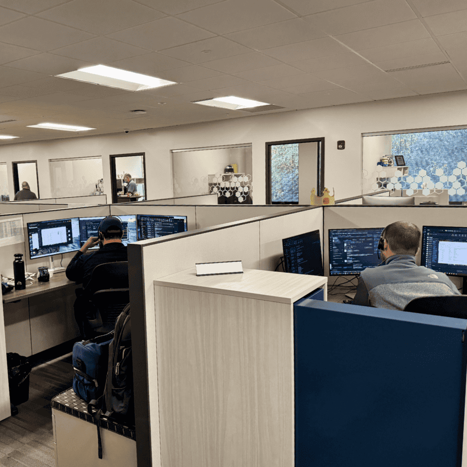 Wide shot of Anderson office room, employees at desks 1080