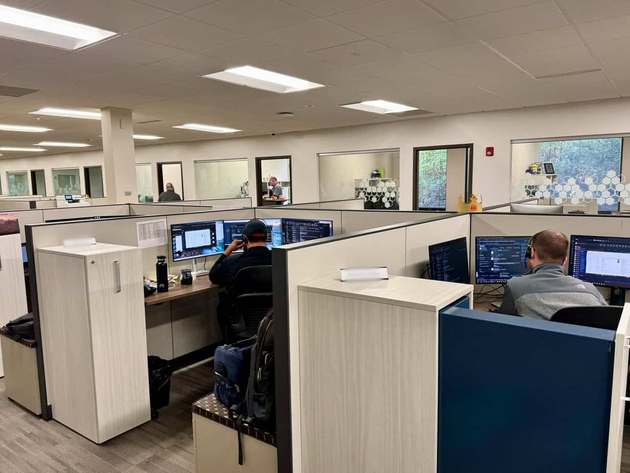 Anderson office shot with cubical with hexagon graphics on windows